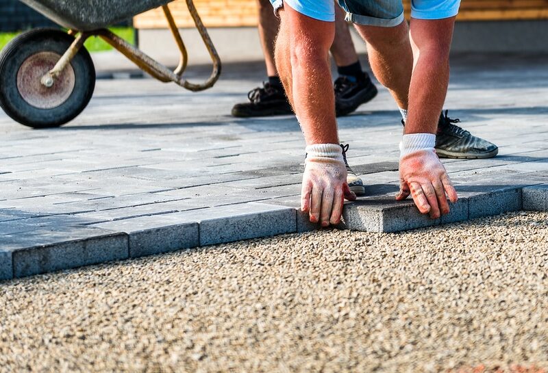 bigstock-Laying-Gray-Concrete-Paving-Sl-259289362-800x545